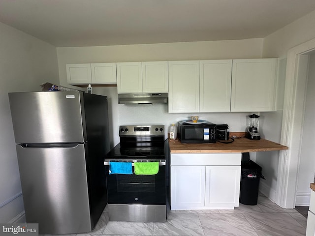 202 N Penn St, York, PA 17401 - kitchen with stainless steel appliances, under cabinet range hood, light marble finish floors, and white cabinets