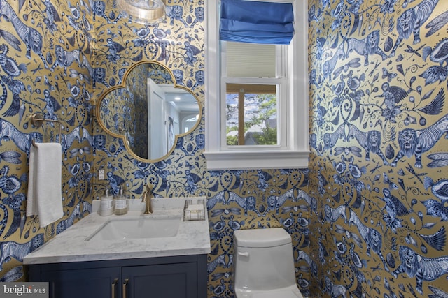 6200 Broad Branch Rd NW, Washington, DC 20015 - half bath featuring wallpapered walls, vanity, and toilet