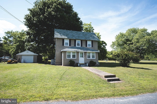 2570 Hickman Ln, Nanticoke, MD 21840 - view of front facade with a detached garage, an outbuilding, and a front yard
