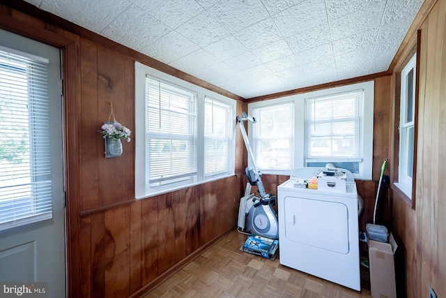2570 Hickman Ln, Nanticoke, MD 21840 - washroom with washer / clothes dryer, wood walls, plenty of natural light, and ornamental molding