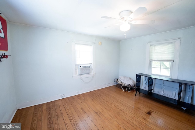 2570 Hickman Ln, Nanticoke, MD 21840 - empty room featuring wood-type flooring, a ceiling fan, baseboards, and cooling unit