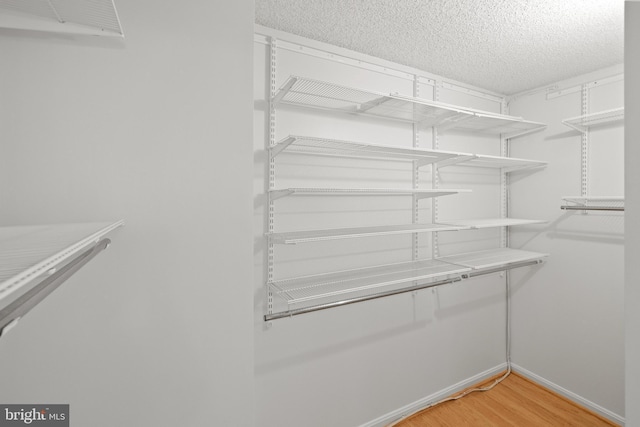 3800 Powell Ln Unit 629, Falls Church, VA 22041 - walk in closet featuring light wood finished floors