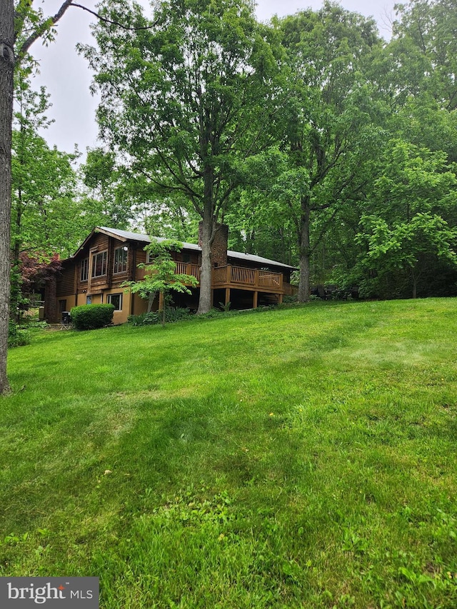 1367 Ed Arnold Rd, Augusta, WV 26704 - view of green lawn featuring a deck