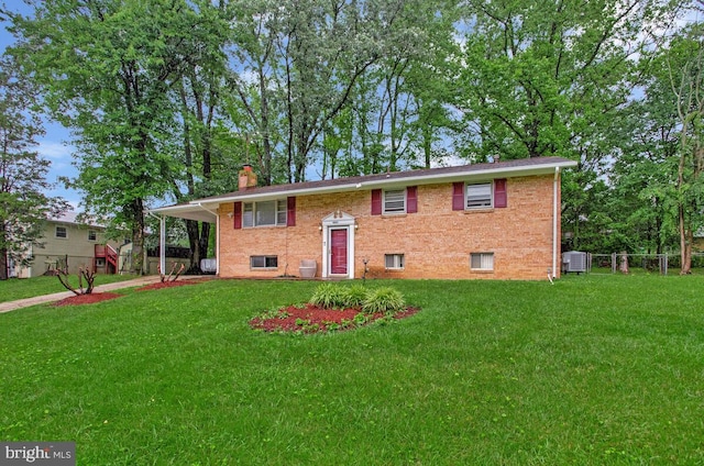 9803 Luke Ct, Upper Marlboro, MD 20772 - raised ranch featuring a chimney, brick siding, and an attached carport