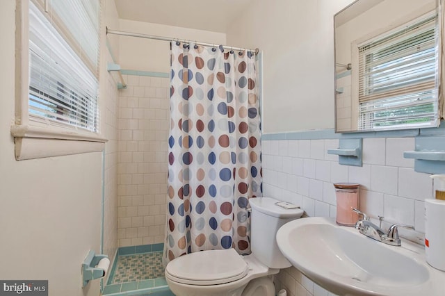 9803 Luke Ct, Upper Marlboro, MD 20772 - bathroom featuring a stall shower, wainscoting, and tile walls