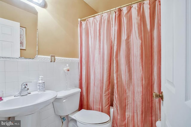9803 Luke Ct, Upper Marlboro, MD 20772 - full bath with tile walls, shower / tub combo, and wainscoting