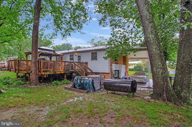 9803 Luke Ct, Upper Marlboro, MD 20772 - back of property with a gazebo, a deck, and an attached carport