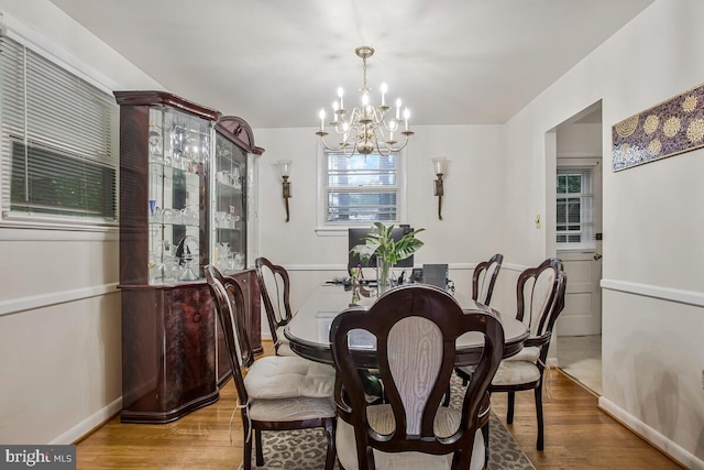 9803 Luke Ct, Upper Marlboro, MD 20772 - dining area featuring a chandelier and wood finished floors