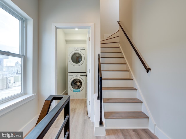 632 Moyer St, Philadelphia, PA 19125 - stairway with stacked washer / dryer and wood finished floors