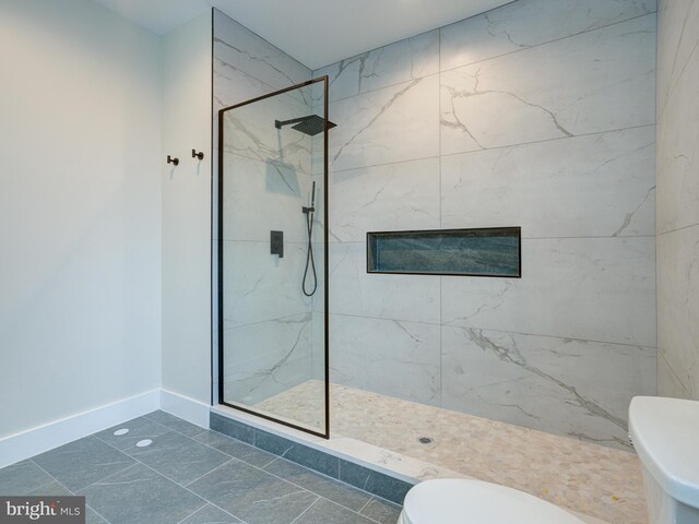632 Moyer St, Philadelphia, PA 19125 - full bath featuring toilet, a marble finish shower, baseboards, and marble look tiles