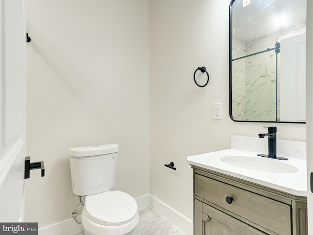 632 Moyer St, Philadelphia, PA 19125 - bathroom featuring marble finish flooring, baseboards, toilet, vanity, and a shower