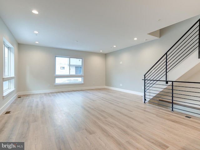 632 Moyer St, Philadelphia, PA 19125 - unfurnished living room with baseboards, light wood-style floors, and recessed lighting