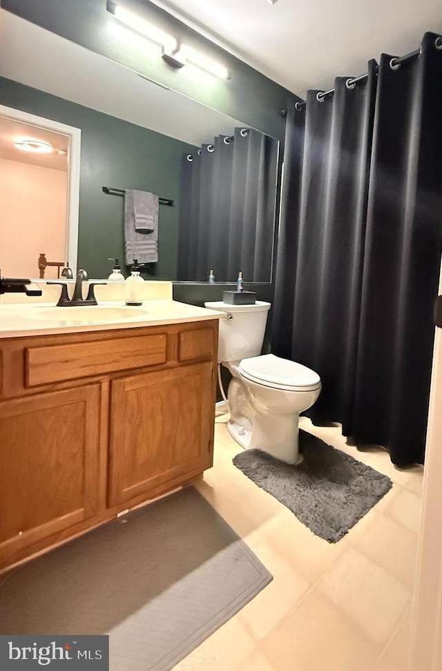 14926 Dunvegan Ct, Silver Spring, MD 20906 - full bathroom with toilet, vanity, and a shower with shower curtain