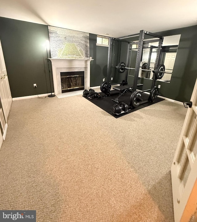 14926 Dunvegan Ct, Silver Spring, MD 20906 - exercise room featuring baseboards, a fireplace with flush hearth, and carpet