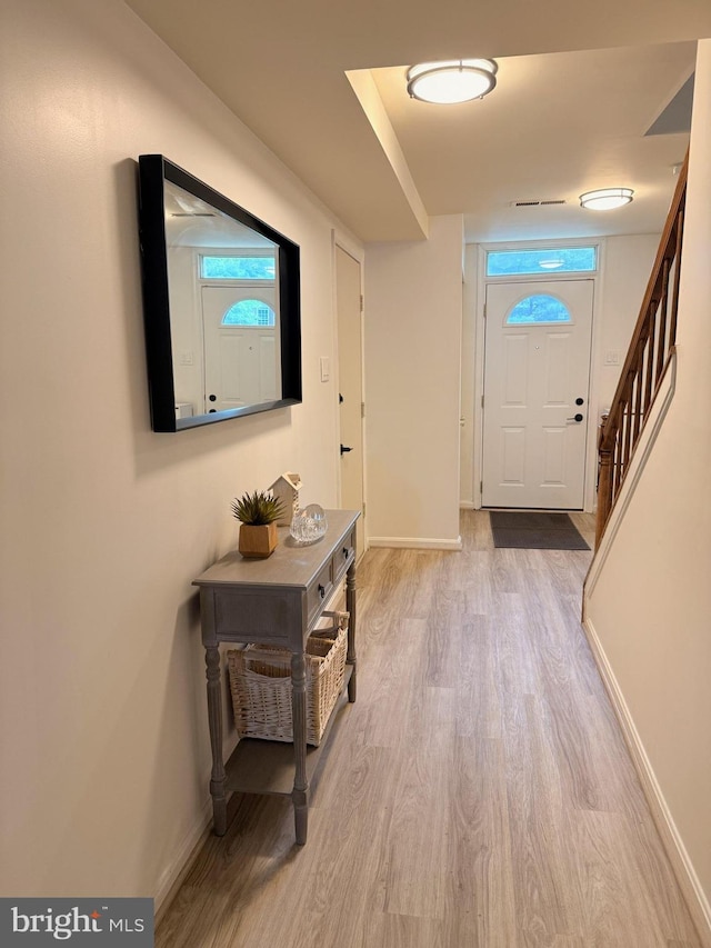 14926 Dunvegan Ct, Silver Spring, MD 20906 - foyer with wood finished floors, baseboards, and stairs