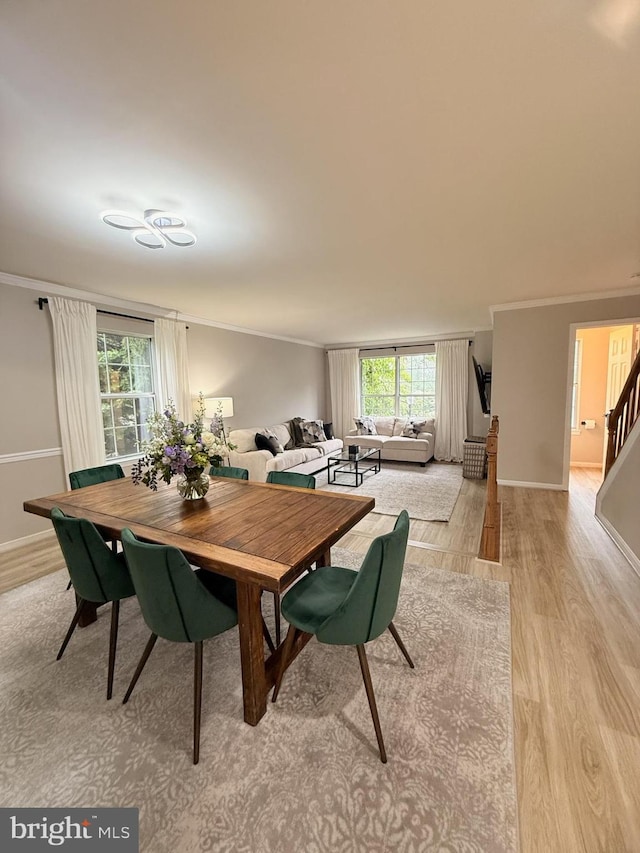 14926 Dunvegan Ct, Silver Spring, MD 20906 - dining space featuring light wood-style flooring, ornamental molding, baseboards, and stairway
