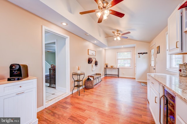 54 Camellia Rd, Levittown, PA 19057 - living area featuring light wood-type flooring, ceiling fan, healthy amount of natural light, lofted ceiling, and wine cooler