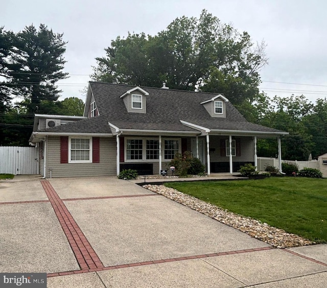 54 Camellia Rd, Levittown, PA 19057 - cape cod-style house with a gate, covered porch, driveway, and a shingled roof