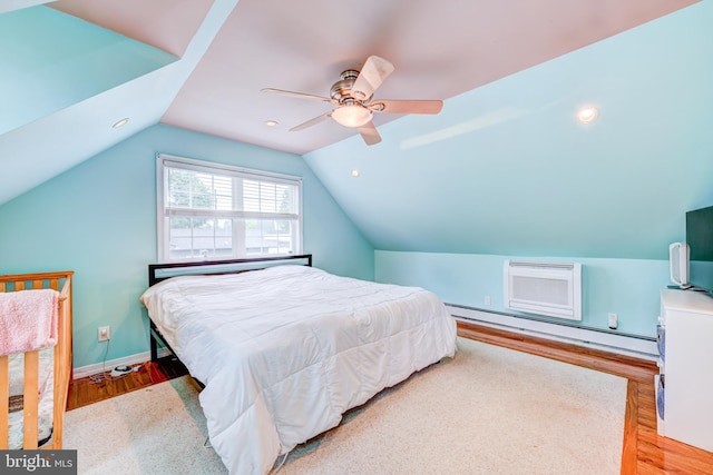 54 Camellia Rd, Levittown, PA 19057 - bedroom featuring baseboard heating, light wood finished floors, vaulted ceiling, a ceiling fan, and baseboards