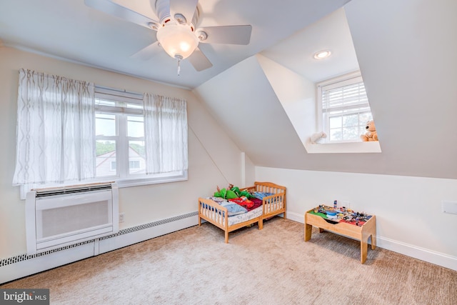 54 Camellia Rd, Levittown, PA 19057 - bedroom featuring carpet flooring, a baseboard radiator, baseboards, vaulted ceiling, and a wall unit AC