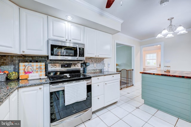 54 Camellia Rd, Levittown, PA 19057 - kitchen with stainless steel appliances, ornamental molding, and white cabinets