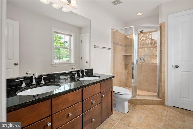 3427 Ramsgate Ter, Alexandria, VA 22309 - bathroom with a shower stall, toilet, double vanity, and tile patterned floors
