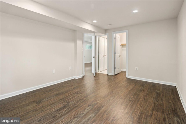 3427 Ramsgate Ter, Alexandria, VA 22309 - unfurnished bedroom featuring baseboards, dark wood-style floors, recessed lighting, and a walk in closet