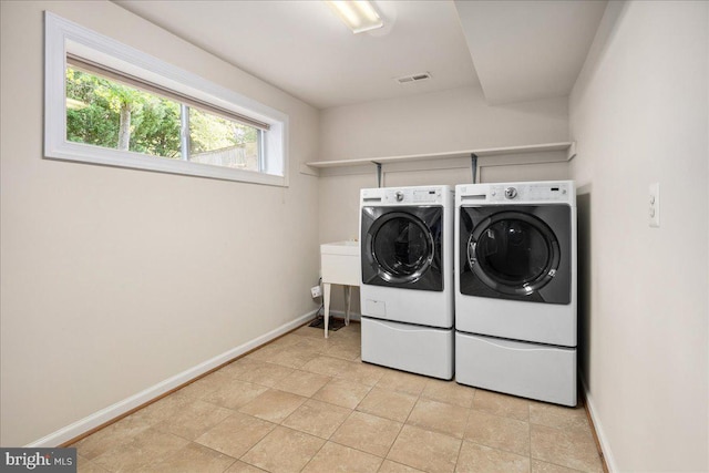 3427 Ramsgate Ter, Alexandria, VA 22309 - laundry room with washing machine and clothes dryer and baseboards