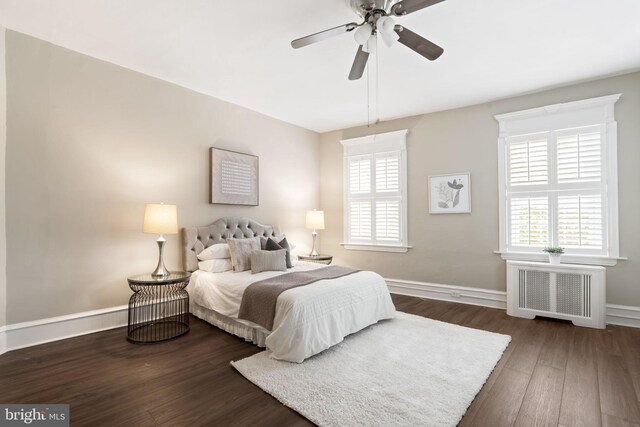858 S Front St, Philadelphia, PA 19147 - bedroom with radiator, wood finished floors, baseboards, and ceiling fan