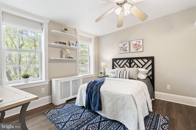 858 S Front St, Philadelphia, PA 19147 - bedroom featuring radiator, baseboards, wood finished floors, and multiple windows