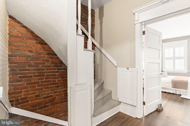 858 S Front St, Philadelphia, PA 19147 - stairway with wood finished floors and brick wall