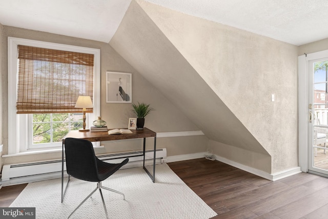 858 S Front St, Philadelphia, PA 19147 - home office featuring wood finished floors, vaulted ceiling, baseboards, a baseboard heating unit, and a textured ceiling