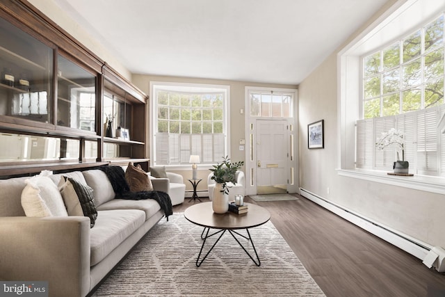 858 S Front St, Philadelphia, PA 19147 - living room featuring a baseboard radiator, wood finished floors, and baseboards