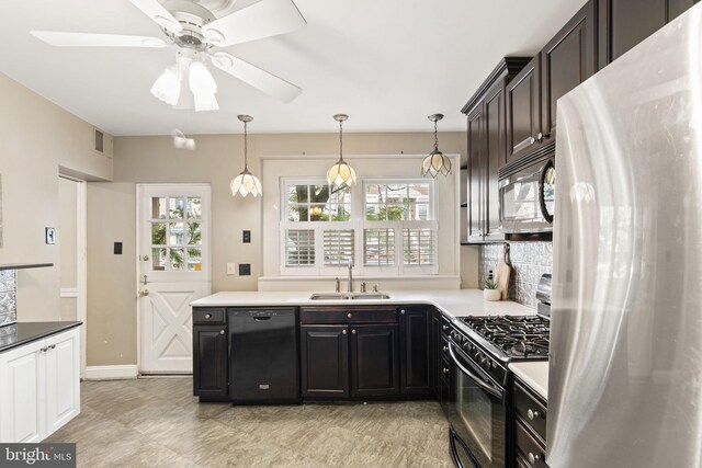 858 S Front St, Philadelphia, PA 19147 - kitchen featuring black appliances, a sink, a ceiling fan, decorative light fixtures, and baseboards