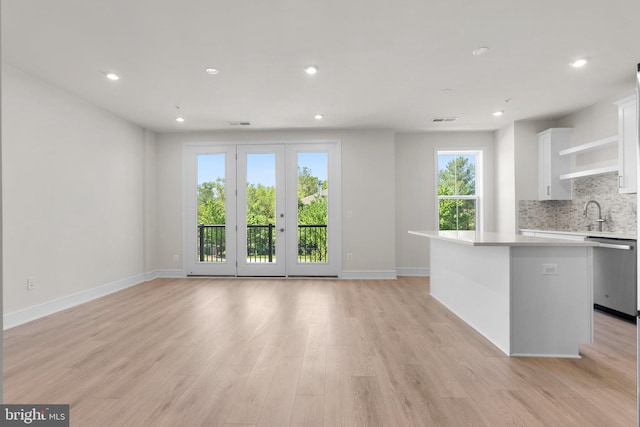 43288 Farringdon Sq, Broadlands, VA 20148 - kitchen featuring dishwasher, light countertops, white cabinetry, a center island, and recessed lighting