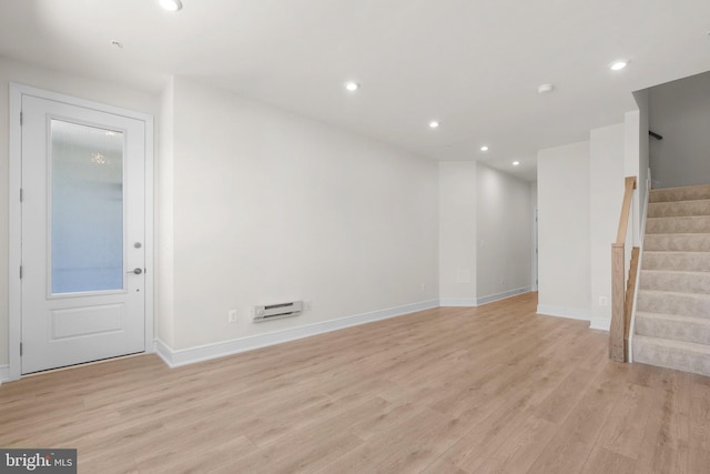 43288 Farringdon Sq, Broadlands, VA 20148 - unfurnished living room featuring light wood finished floors, stairs, baseboards, and recessed lighting