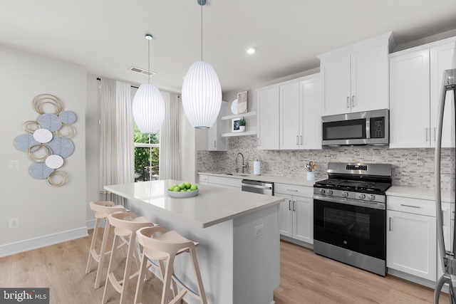 43288 Farringdon Sq, Broadlands, VA 20148 - kitchen with stainless steel appliances, a sink, tasteful backsplash, white cabinetry, and recessed lighting
