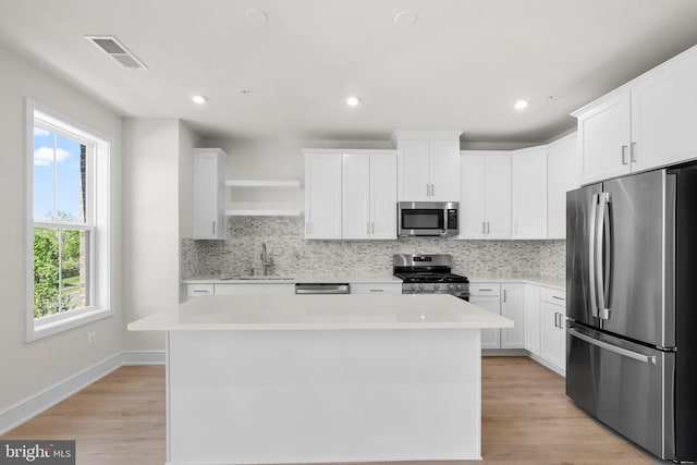43288 Farringdon Sq, Broadlands, VA 20148 - kitchen with stainless steel appliances, tasteful backsplash, light countertops, and recessed lighting