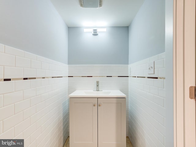 719 Cantrell St, Philadelphia, PA 19148 - bathroom featuring tile walls, vanity, and a wainscoted wall