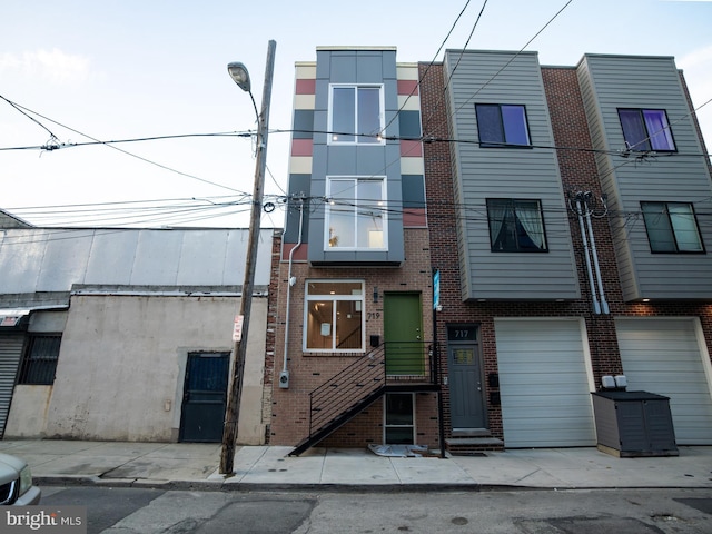719 Cantrell St, Philadelphia, PA 19148 - view of property featuring a garage