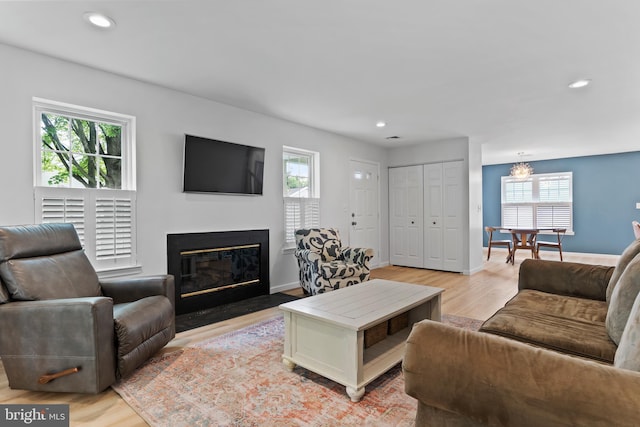 1827 Wexford Rd, Palmyra, PA 17078 - living room with plenty of natural light, a fireplace with flush hearth, light wood-type flooring, recessed lighting, and baseboards