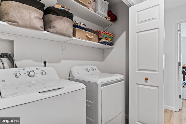 1827 Wexford Rd, Palmyra, PA 17078 - laundry room featuring washing machine and clothes dryer and light wood-style floors