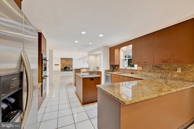 22 Woodholme Village Ct, Baltimore, MD 21208 - kitchen featuring appliances with stainless steel finishes, a peninsula, a sink, light tile patterned floors, and tasteful backsplash