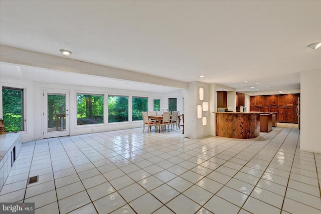 22 Woodholme Village Ct, Baltimore, MD 21208 - unfurnished living room featuring light tile patterned floors and recessed lighting