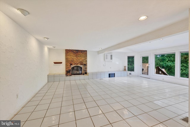22 Woodholme Village Ct, Baltimore, MD 21208 - unfurnished living room featuring a fireplace, a textured wall, light tile patterned floors, and recessed lighting
