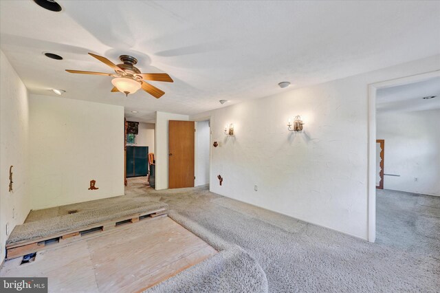22 Woodholme Village Ct, Baltimore, MD 21208 - unfurnished living room with carpet and ceiling fan