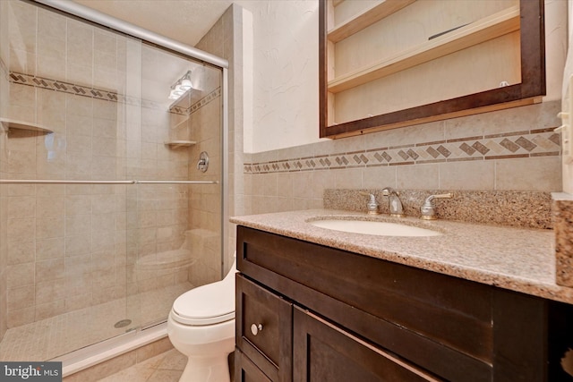 22 Woodholme Village Ct, Baltimore, MD 21208 - full bathroom with vanity, toilet, tile walls, a stall shower, and tile patterned floors
