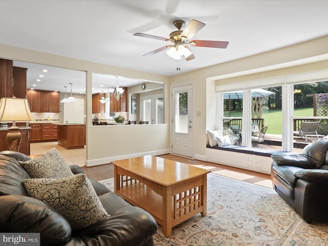 6805 Spout Ln, Fairfax Station, VA 22039 - living area with a chandelier, a ceiling fan, recessed lighting, light wood-style floors, and baseboards