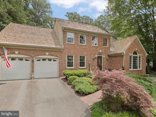 6805 Spout Ln, Fairfax Station, VA 22039 - view of front of property with a garage, brick siding, and driveway