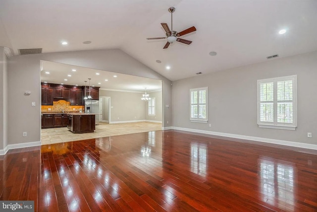 265 N Cologne Ave, Egg Harbor City, NJ 08215 - unfurnished living room featuring ceiling fan, light wood-style flooring, a chandelier, vaulted ceiling, and recessed lighting